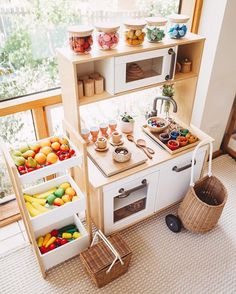 a toy kitchen with lots of food in it