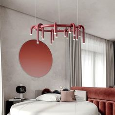 a modern bedroom with red accents and grey walls, including a round mirror hanging over the bed