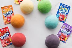 four play doughs and candy on a table