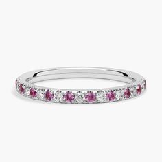 a white gold band with pink and white diamonds