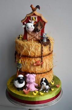 a cake made to look like a farm scene with animals and sheep in the hay