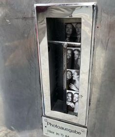 an old metal box with photos in it