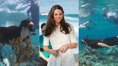 a woman standing in front of an aquarium with penguins and other animals on the wall