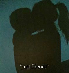 the silhouette of two people kissing in front of a blue background with words just friends