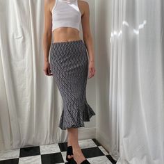 Vintage 00s Y2K black and white bias cut midi skirt. Black floaty midi skirt with bold white abstract pattern and bias cut hem with frill/pleats. Graphic print. Slinky stretch fabric. Waist is elasticated. Size S on the label seen on a size 8/10 (5ft9) Fits like a UK 10. Perfect condition. Brand: PERSEPTION CONCEPT. Measurements Waist: 28 inches Length: 31 inches Y2k Black And White, Y2k Black, Abstract Pattern, No Frills, Stretch Fabric, Midi Skirt, Womens Skirt, Black And White, Clothes For Women