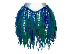 a blue and green necklace on a mannequin's neckpiece with fringes