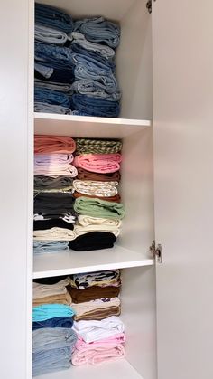 the closet is full of folded and unbuttoned shirts