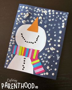 a paper card with a snowman on it