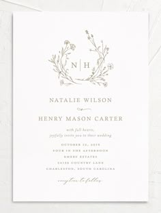 an elegant wedding card with the letter n on it