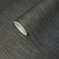 a close up view of a grey fabric with a white circle on it's end