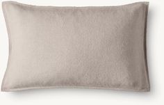 a gray pillow with a white background