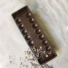 a chocolate tray filled with nuts on top of a table