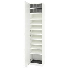 an empty white cabinet with shelves and doors