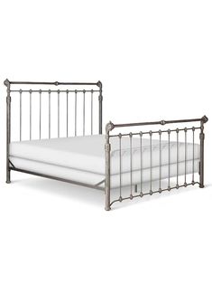 a metal bed frame with white sheets and pillows on top of it, against a white background