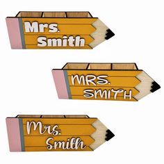 two pencils with the words mrs smith and mr smith written on them are shown