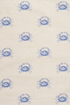 a blue and white crab pattern on fabric