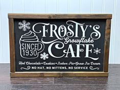 frosty's squarecake cafe sign displayed on wooden table