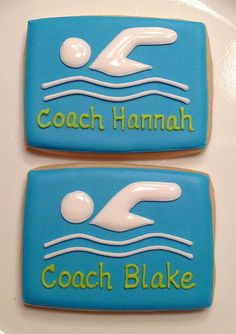 two cookies decorated with the words coach hannah and a swimmer