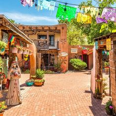 an outdoor market with lots of colorful decorations