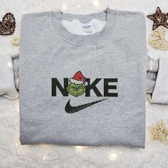 The Grinch Xmas x Nike Movie Embroidered Sweatshirt is the perfect blend of holiday cheer and athletic style. Featuring the Grinch Head, Nike Christmas, Disney Character Shirts, One Piece Hoodie, Walt Disney Characters, Mike Wazowski, Cartoon Shirts, Patrick Star, Cartoon Sweatshirts