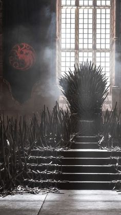 the iron throne sits in front of an open window