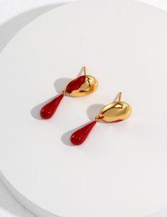 It's made of S925 sterling silver, plated with 18k gold, and red drop glaze.  Love the gold and red together, very Christmasy.  It's about 29mm*10mm.  If you like the other butterfly bow earrings, please also check it out under my earrings collection! Thanks! Red Gold Plated Drop Earrings, Red Gold Plated Earrings For Party, Shiny Dangle Earrings As Gift, Shiny Dangle Earrings For Gift, Shiny Finish Dangle Earrings Gift, Shiny Finish Dangle Earrings For Gift, Red Drop Earrings For Gift, Drop Shaped Jewelry With Shiny Finish For Gifts, Red Drop-shaped Jewelry For Gift