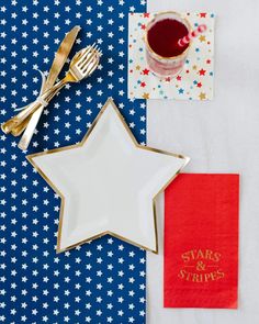 a star shaped plate next to a napkin and fork