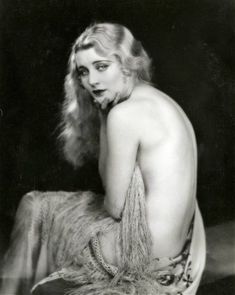 an old black and white photo of a naked woman