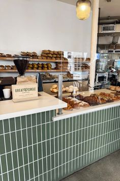 a bakery counter filled with lots of pastries