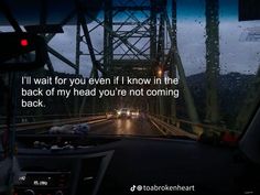 a car driving down a rain soaked road with the words i'll wait for you even if i know in the back of my head you're not coming back