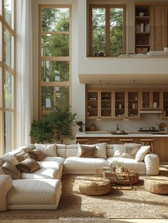 a living room filled with furniture and lots of windows