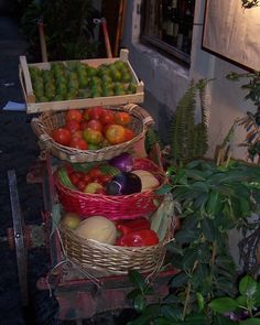 three baskets filled with different types of fruit