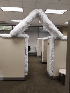 an office cubicle decorated with snow and ice