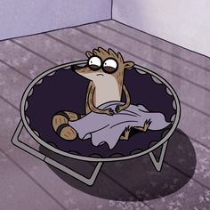 a cartoon character sitting in a chair on the floor