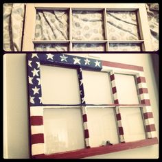 an american flag painted on the side of a window with glass panes in it