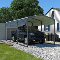 a truck is parked in front of a house with a carport attached to it