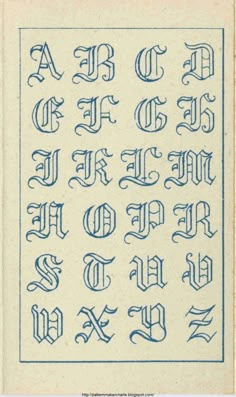 an old fashioned type of calligraphy in blue ink on white paper with the letters and numbers