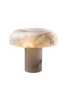 a white marble table lamp on a white background