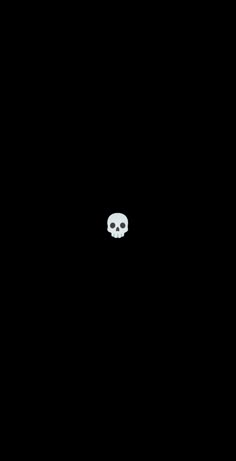 a black background with a white skull in the middle and one eye on the left