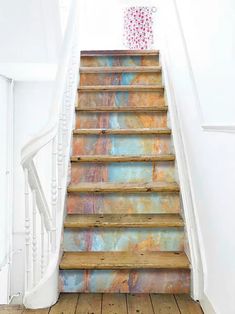 the stairs are painted with different colors and designs