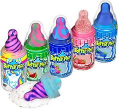 four bottles of different flavored ice creams in various colors and sizes, with one being filled with whipped cream