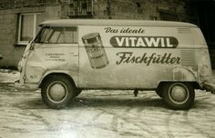 an old van is parked in the snow