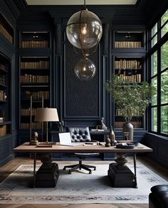 an office with black walls, leather furniture and lots of bookshelves in it