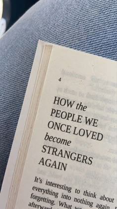 an open book with the title how the people we once loved become strangers again written on it