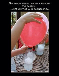 someone holding a red frisbee over two plastic cups