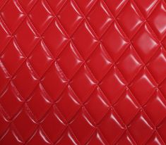 a red leather texture background that looks like it is made out of squares and rectangles