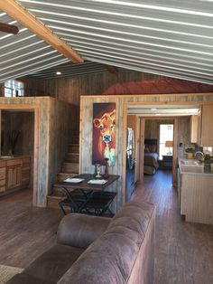 a living room and dining area in a cabin