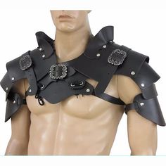 a male mannequin dressed in black leather with chains and buckles on his chest