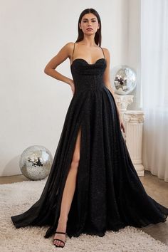 A woman stands confidently in a black, sequined gown with a high slit, adorned with thin straps. The backdrop features a bright room with a disco ball and soft lighting. Plus Size Gowns Formal, Cute Bridesmaid Dresses, Prom Dress Plus Size, Cinderella Divine, Red Bridesmaids, Spaghetti Strap Prom Dress, Corset Dress Prom, Prom Ball Gown, Black Dress Formal