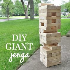 a stack of wooden blocks sitting in the grass